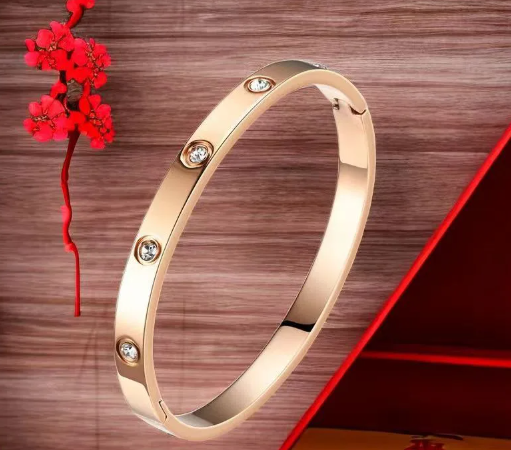 A. BRACCIALE RIGIDO ORO ROSA 009